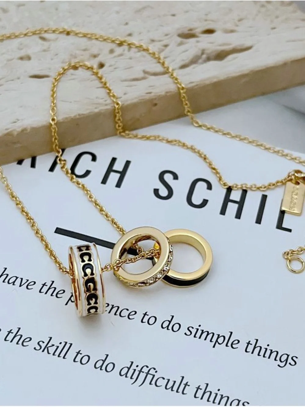 Coach Gold-Tone Pendant Necklace with Black Enamel and Crystal Band